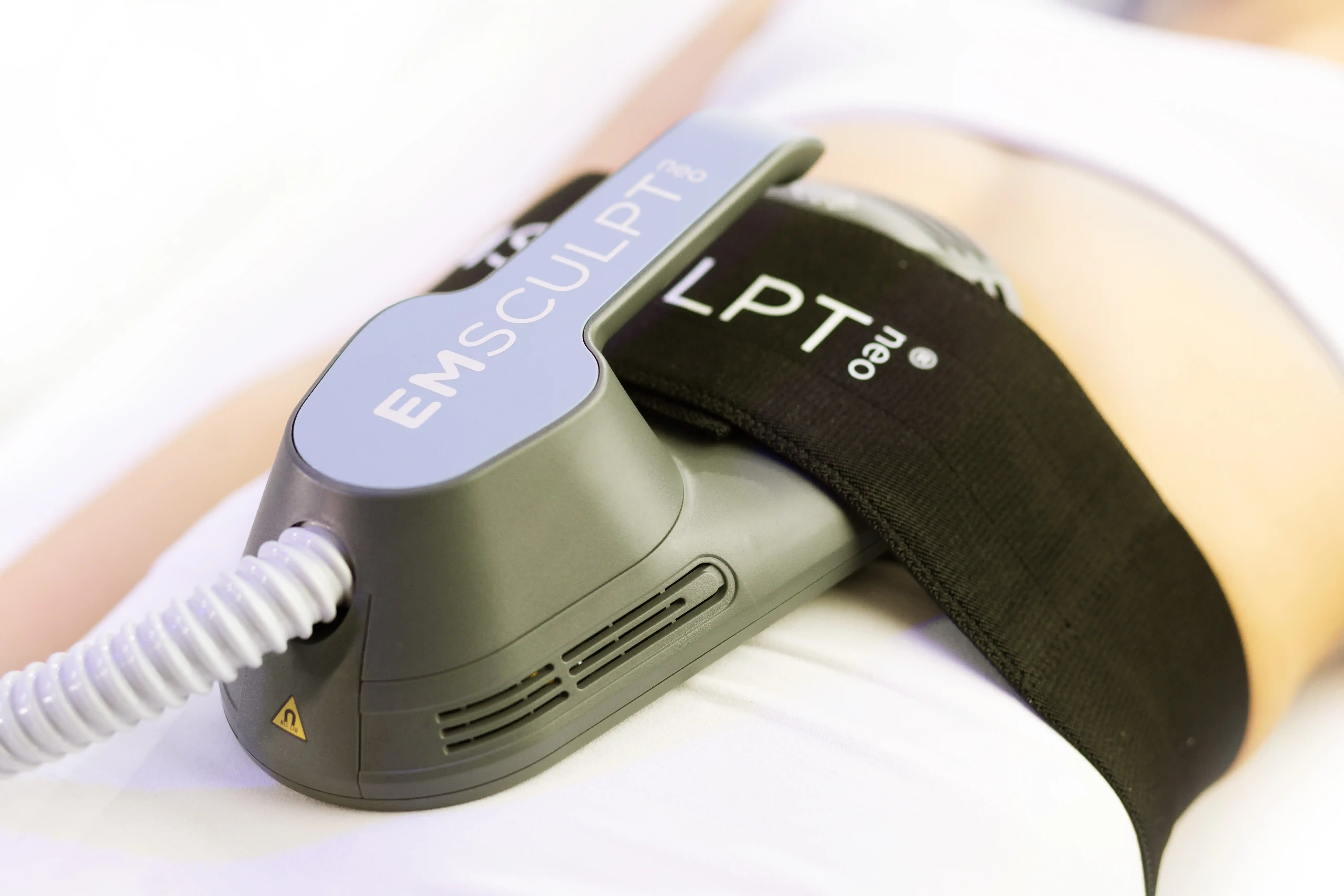 Emsculpt Neo applicator positioned on abdomen in Canton GA clinic